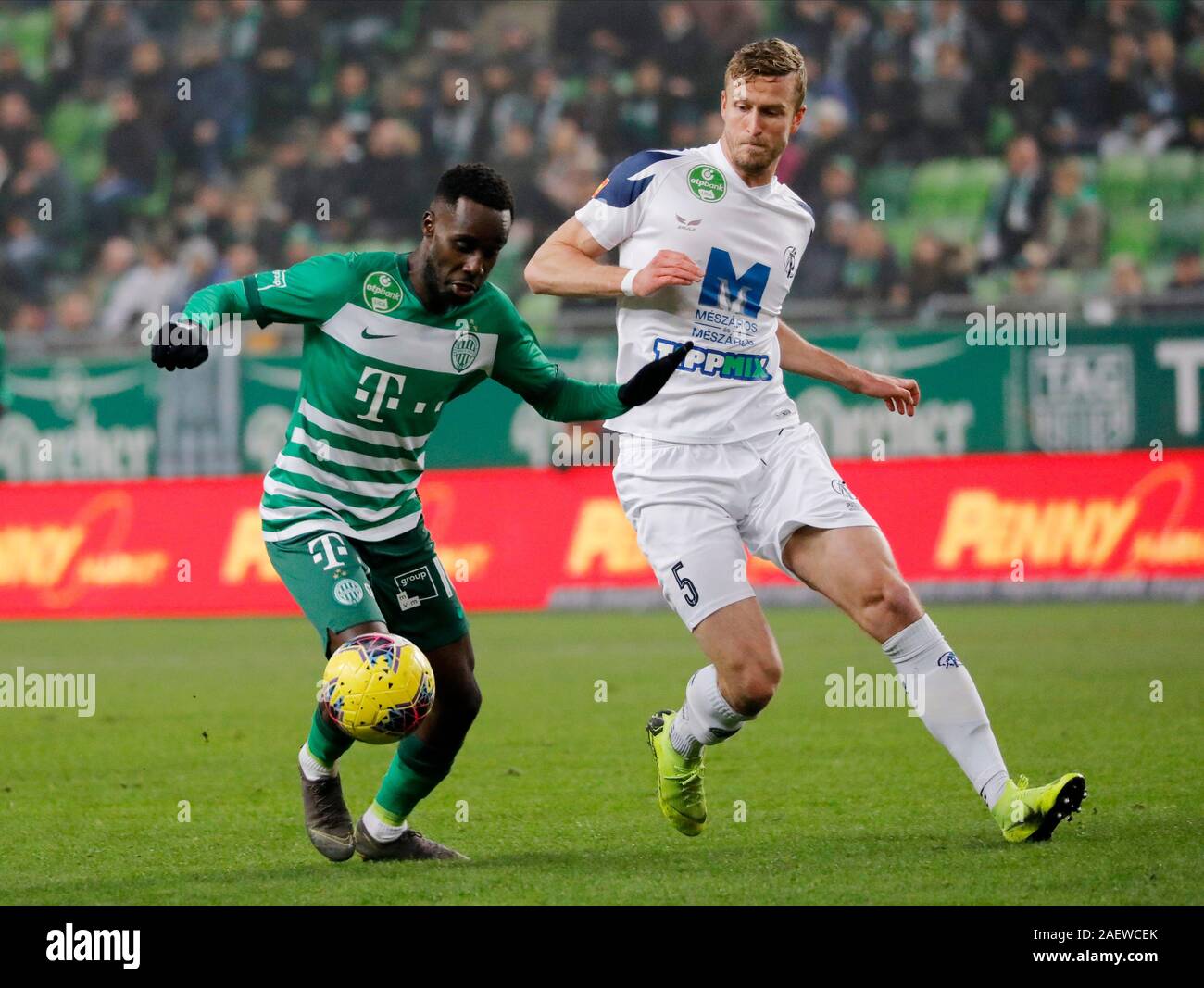 BUDAPEST, HUNGARY - AUGUST 29: (l-r) Tokmac Chol Nguen of Ferencvarosi TC  celebrates his goal in front of Gergo Lovrencsics of Ferencvarosi TC during  the UEFA Europa League Play-off Second Leg match