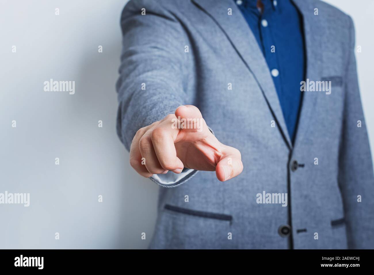 Man in suit pointing with his finger. Stock Photo