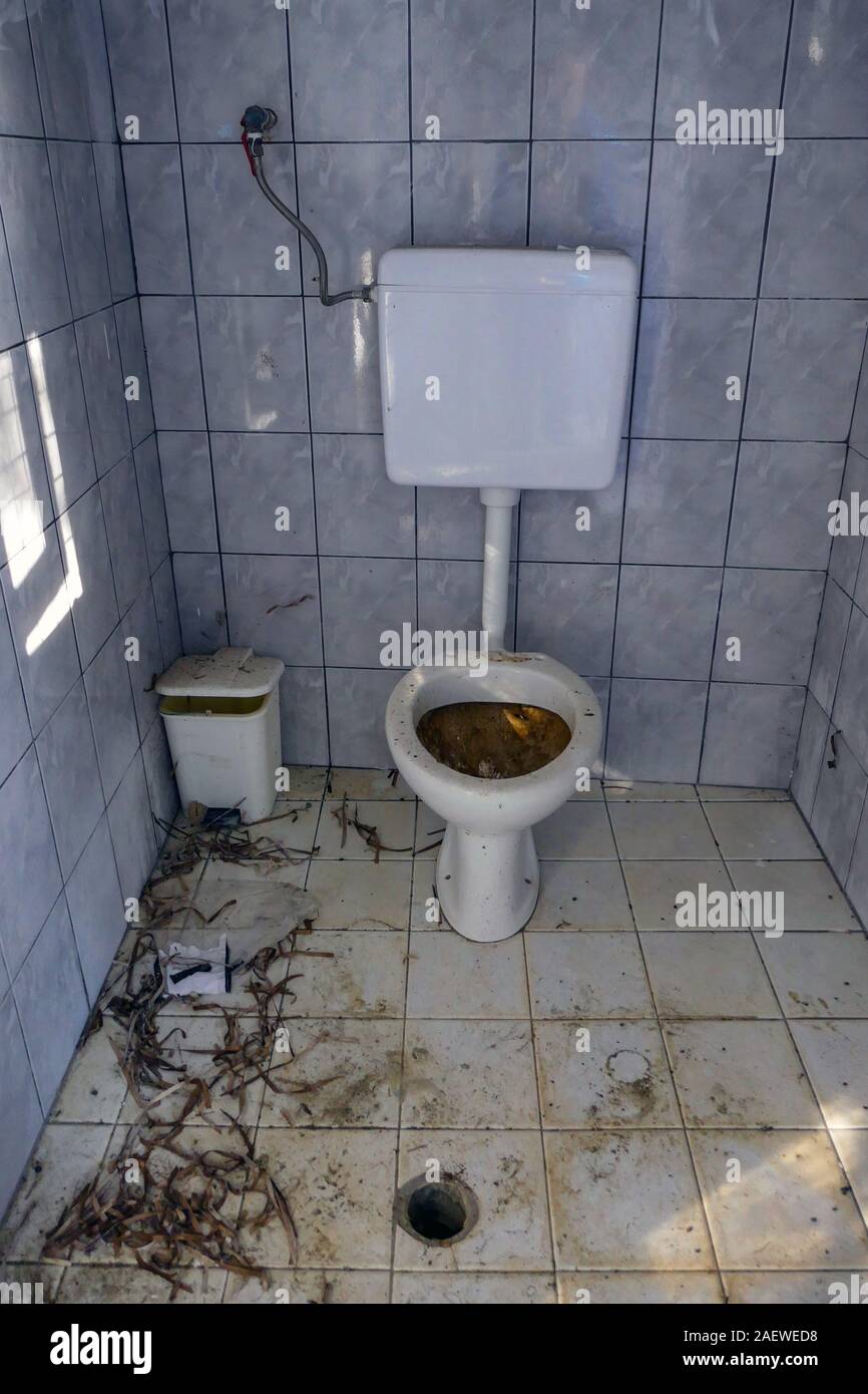 Dirty toilet with no seat, Kalymnos Island, Dodecanese, Greece Stock Photo