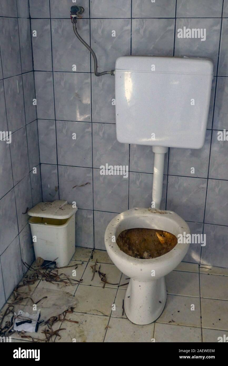 Dirty toilet with no seat, Kalymnos Island, Dodecanese, Greece Stock Photo