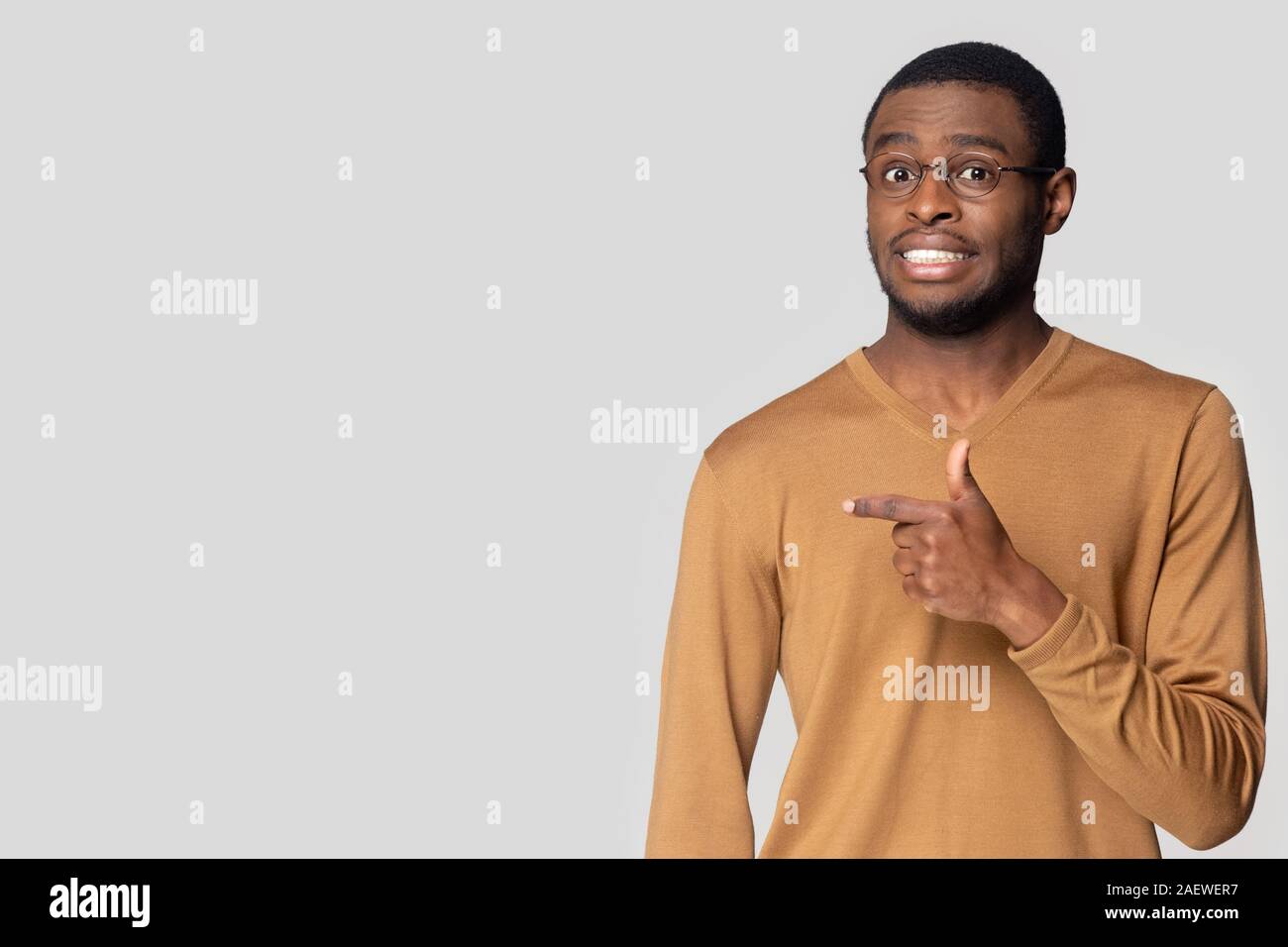 Confused african man pointing hi-res stock photography and images - Alamy