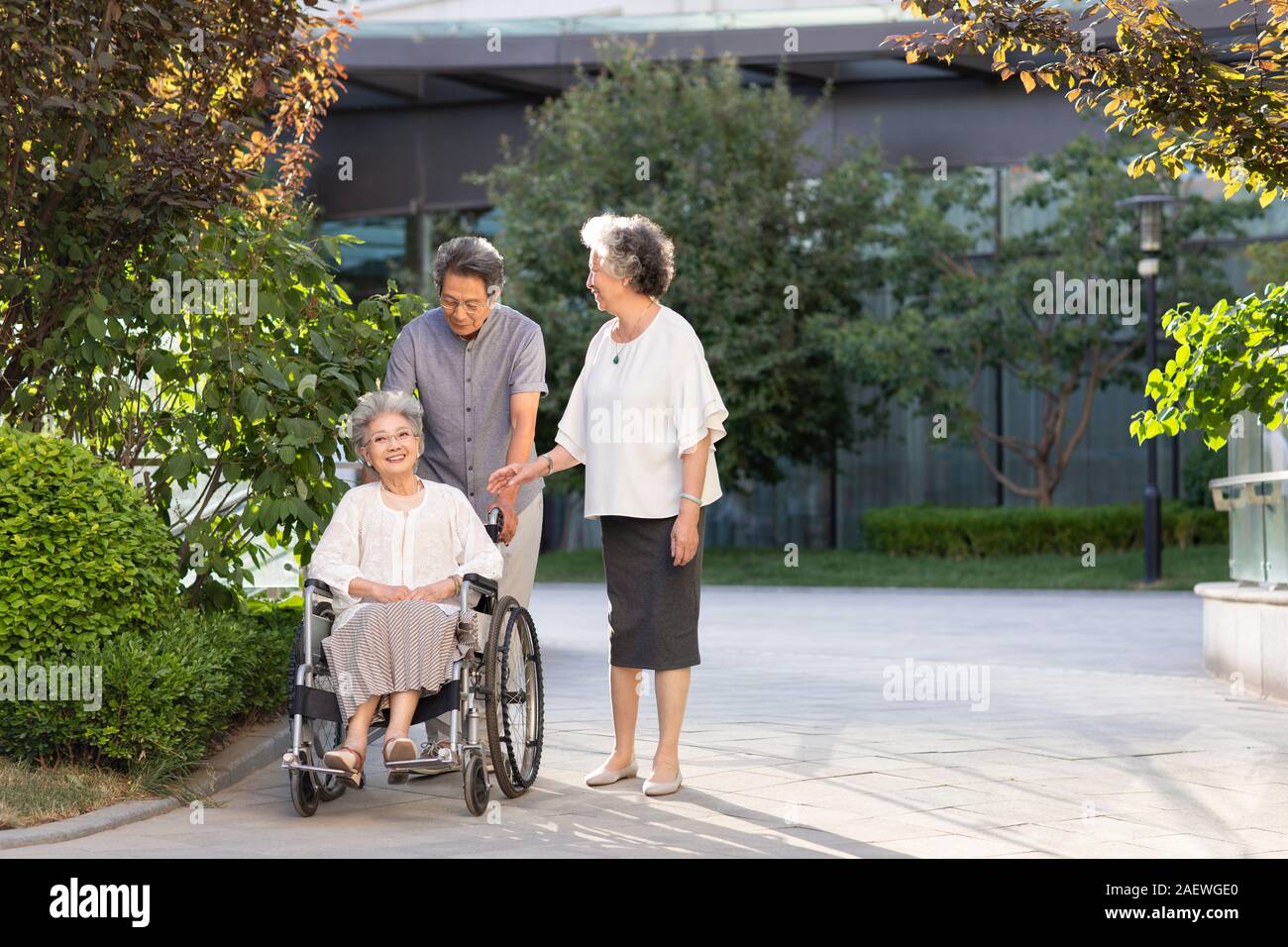 Senior friends walking in nursing home Stock Photo