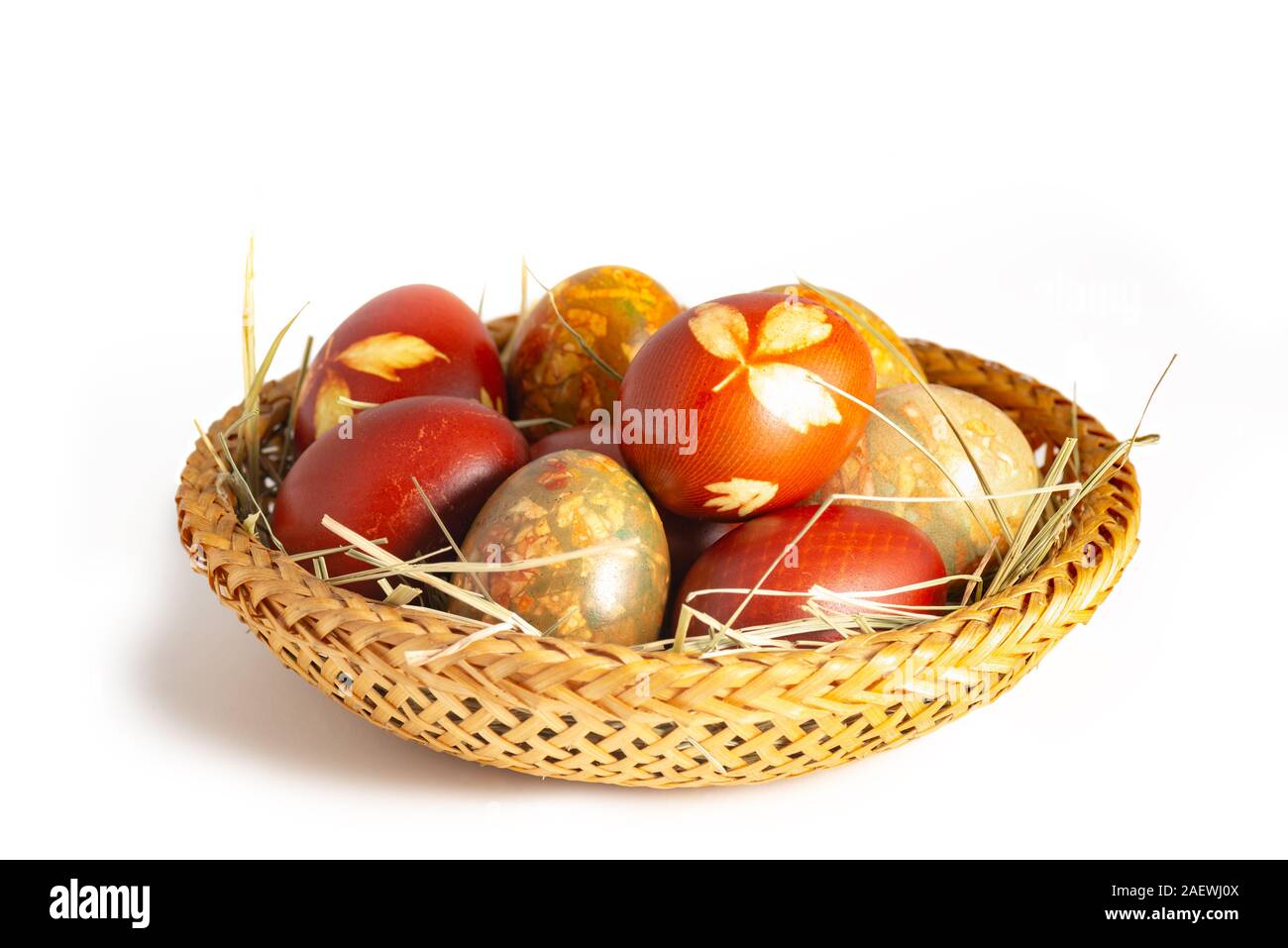 Traditional easter painted eggs in straw basket Stock Photo