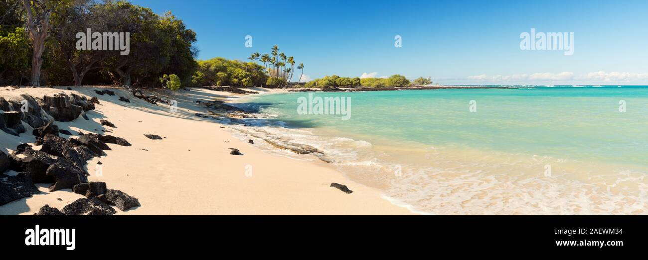 Maiahula Beach on Big Island Hawaii, USA, a beautiful white sand beach with turquoise water and palm trees. Stock Photo