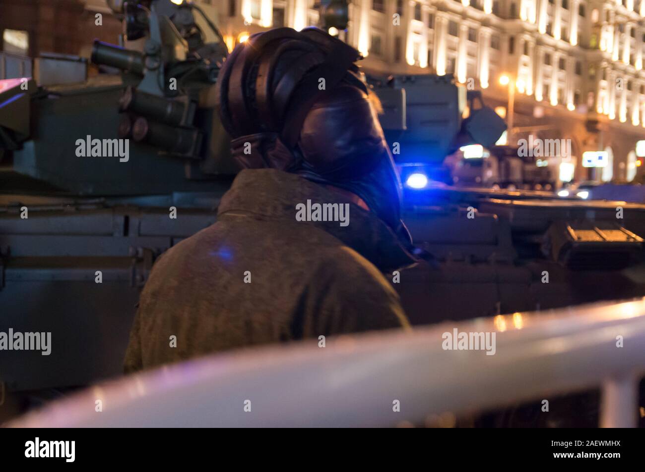 Tank crew, Russian army soldiers, T-90 battle tanks on the streets of night Moscow, Russia Stock Photo