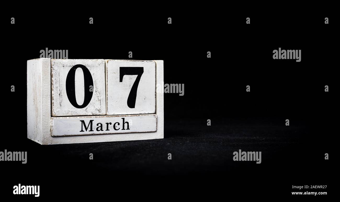 March 7th, Seventh of March, Day 7 of month March - white calendar blocks  on black textured background with empty space for text Stock Photo - Alamy
