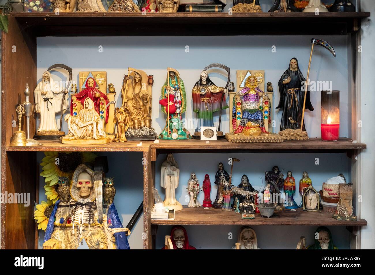 A collection of Santa Muerte stautes in the home temple of a Mexican American devotee of  in Elmhurst, Queens, New York City Stock Photo