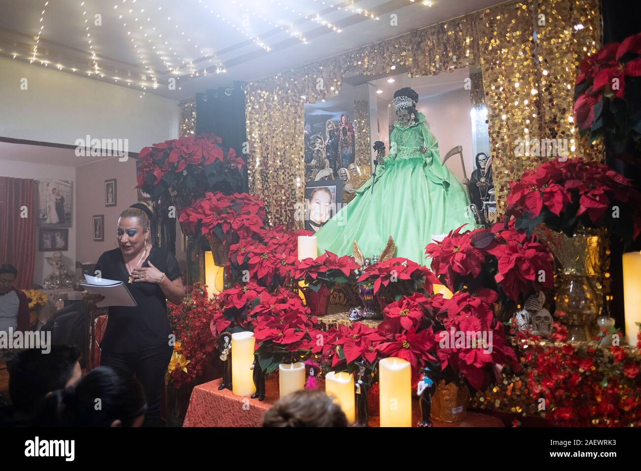 A Santa Muerte priestess leads a service in her home temple in Jackson Heights, Queens, New York City. Stock Photo