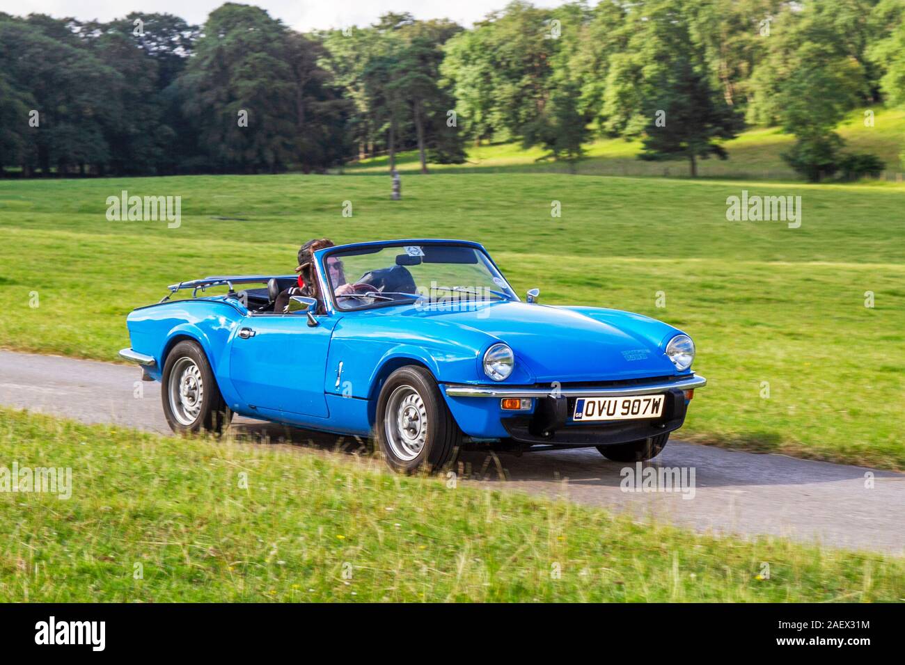 1981 80s blue TRIUMPH SPITFIRE; British front-engined, rear-wheel drive, two-passenger convertible,  Classic cars, historics, cherished, old timers, collectable restored vintage veteran, vehicles of yesteryear arriving for the Mark Woodward historical motoring event at Leighton Hall, Carnforth, UK Stock Photo