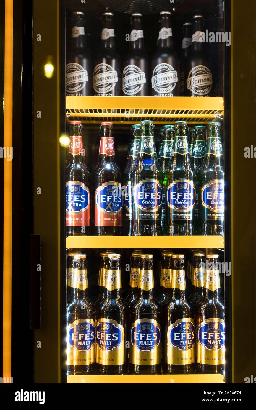 Istanbul, Turkey - December 10 , 2019 : Famous Turkis Beers like, Efes efes malt, bomonti filtresiz bottled beers are in a beverage refrigerator. Stock Photo