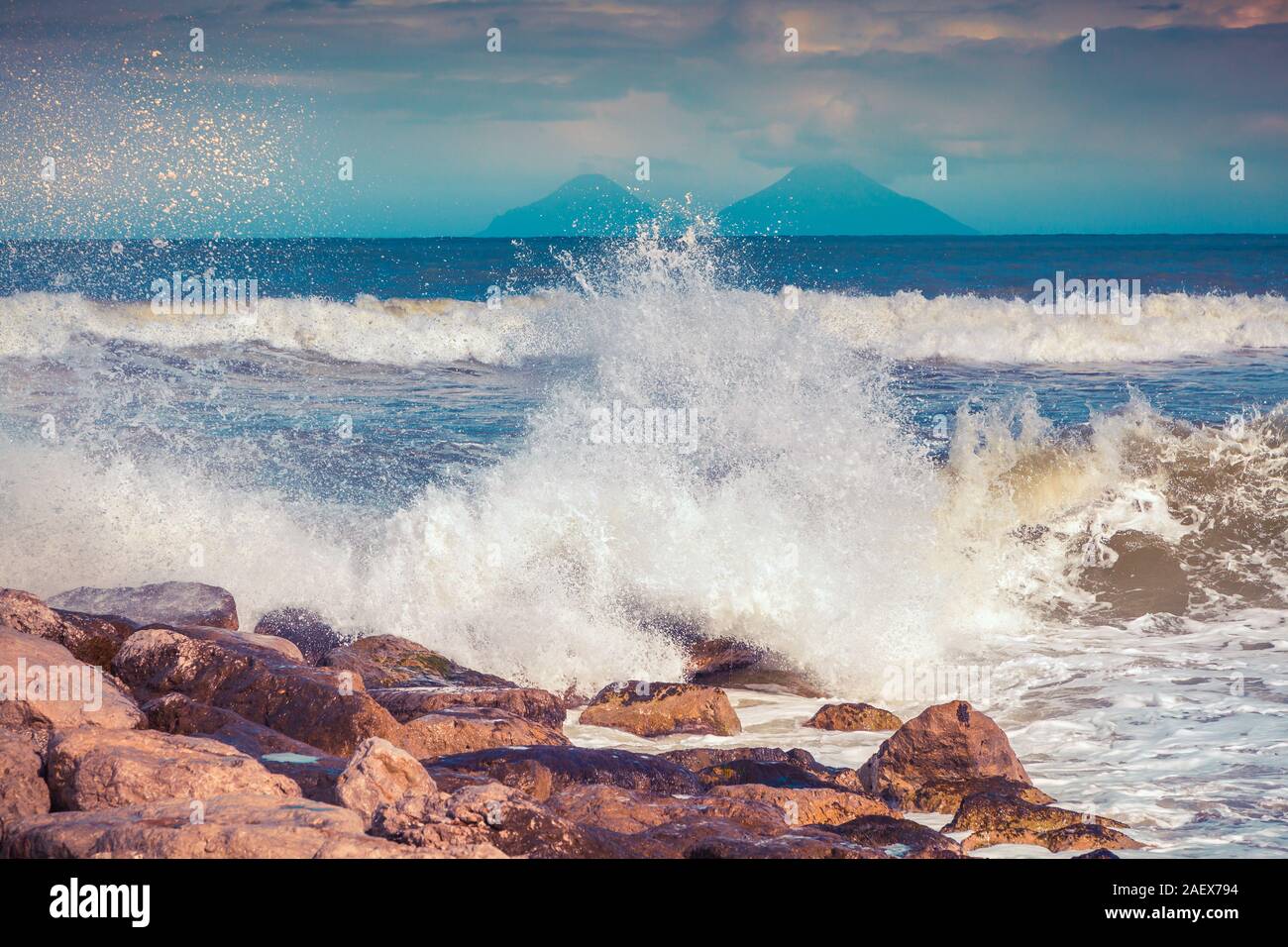 Spring sunny morning on the Mediteranian beach. Stormy wether on Tonnarella, Messina, Sicily, Italy. Instagram toning. Stock Photo