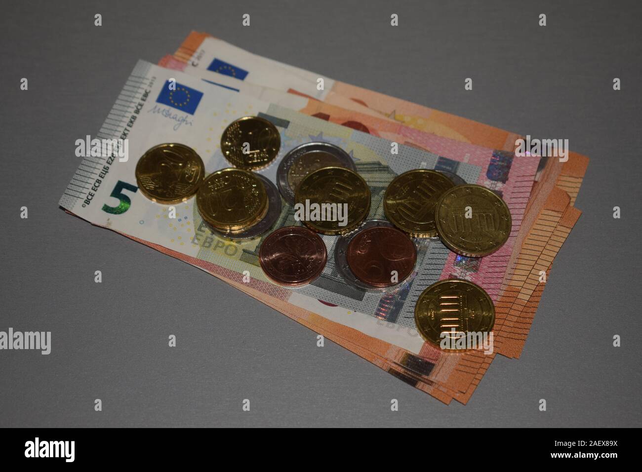 Euro bills and coins Stock Photo - Alamy