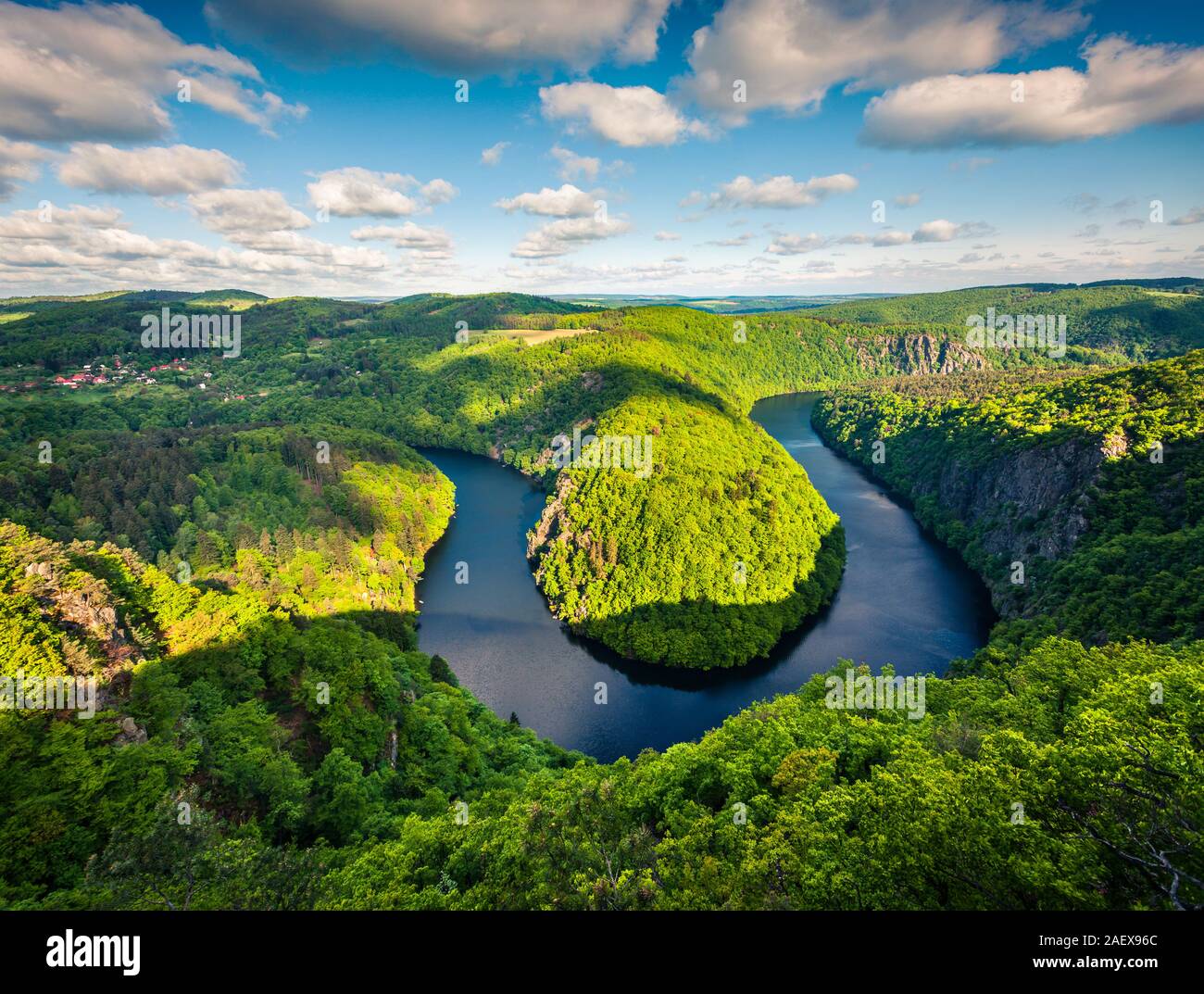 Sunny view of Vltava river horseshoe shape meander from Maj viewpoint. Colorful spring scene in Czech Republic. Artistic style post processed photo. Stock Photo