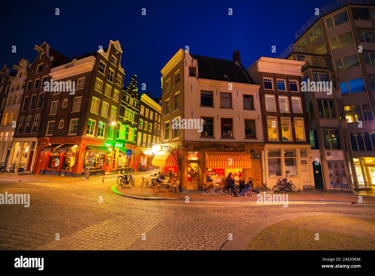 Night view streets of Amsterdam city. Dutch style buildings landscape in spring. Netherlands, Europe. Stock Photo