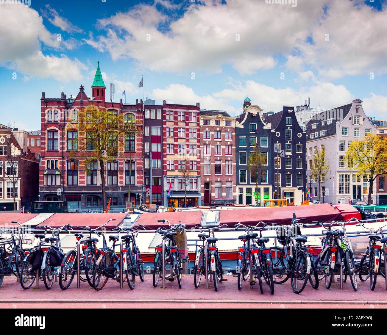 Colorful spring morning in the Amsterdam. Authentic Dutch architecture in the capital and most populous city of the Netherlands. Stock Photo