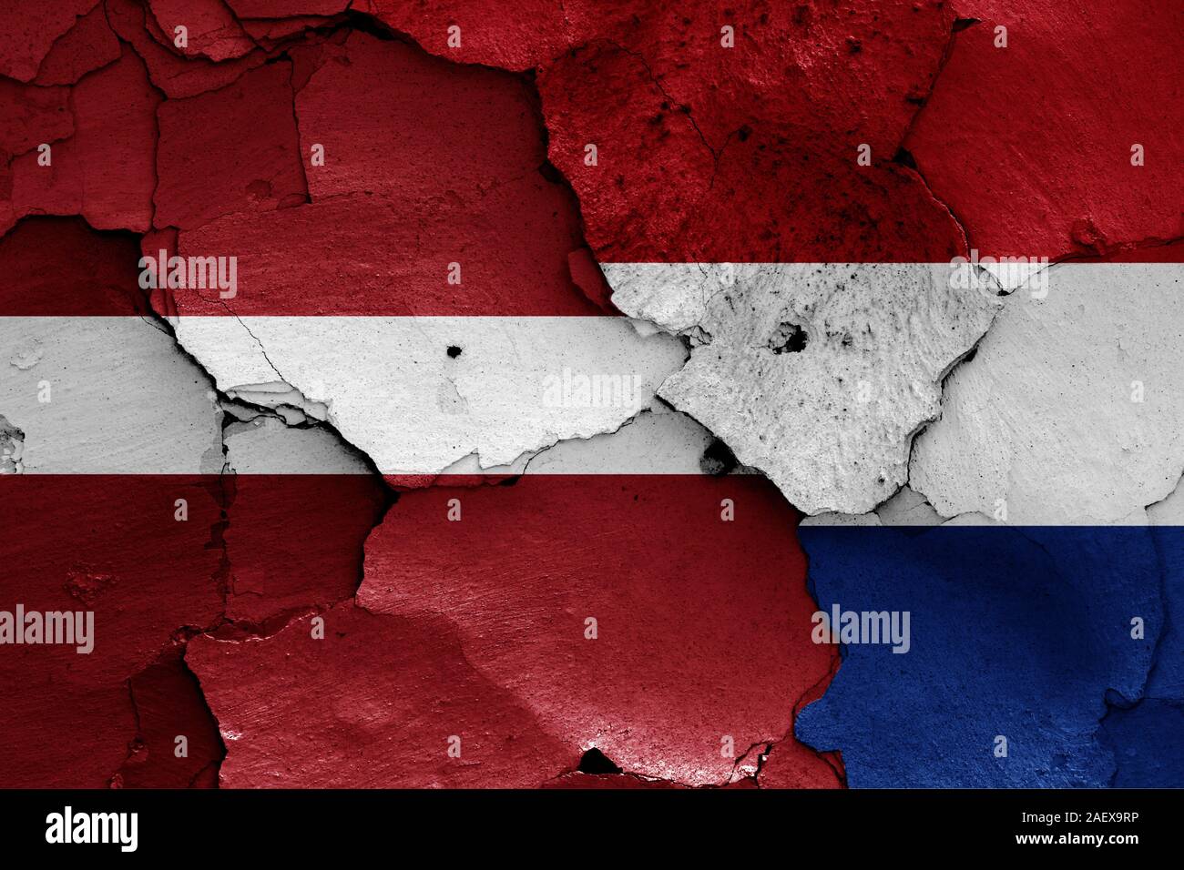 flags of Latvia and Netherlands painted on cracked wall Stock Photo - Alamy