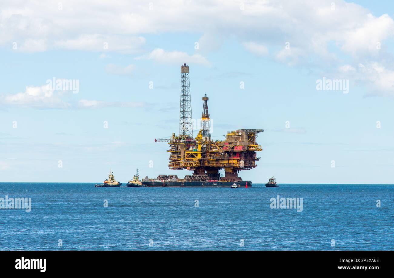 Decommissioned Brent Bravo oil platform being towed towards the River Tees Estuary where it will be dismantled. Middlesborough, England 20th June 2019 Stock Photo