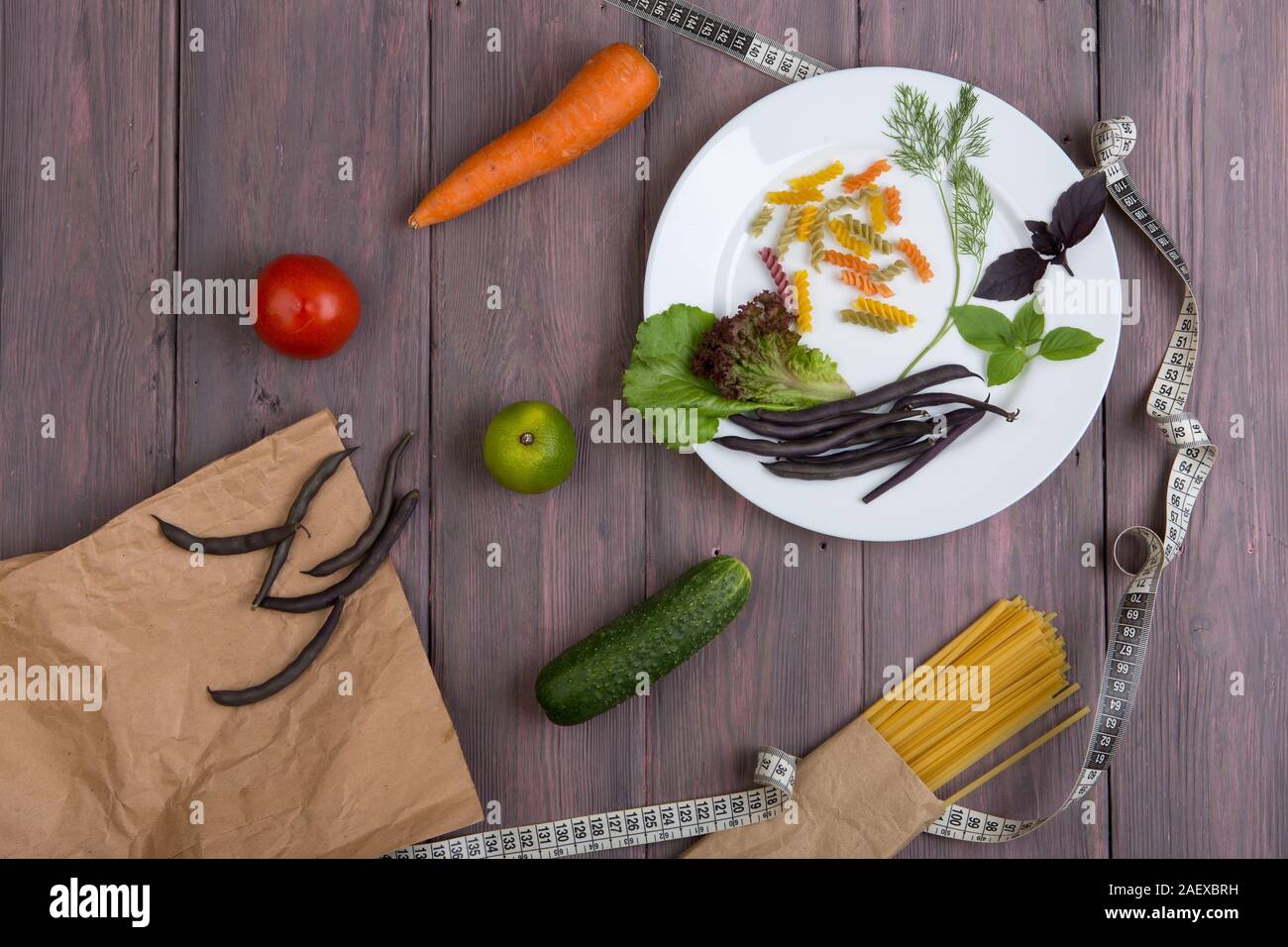 Diet food diary notebook to count calories, centimeter tape, fresh