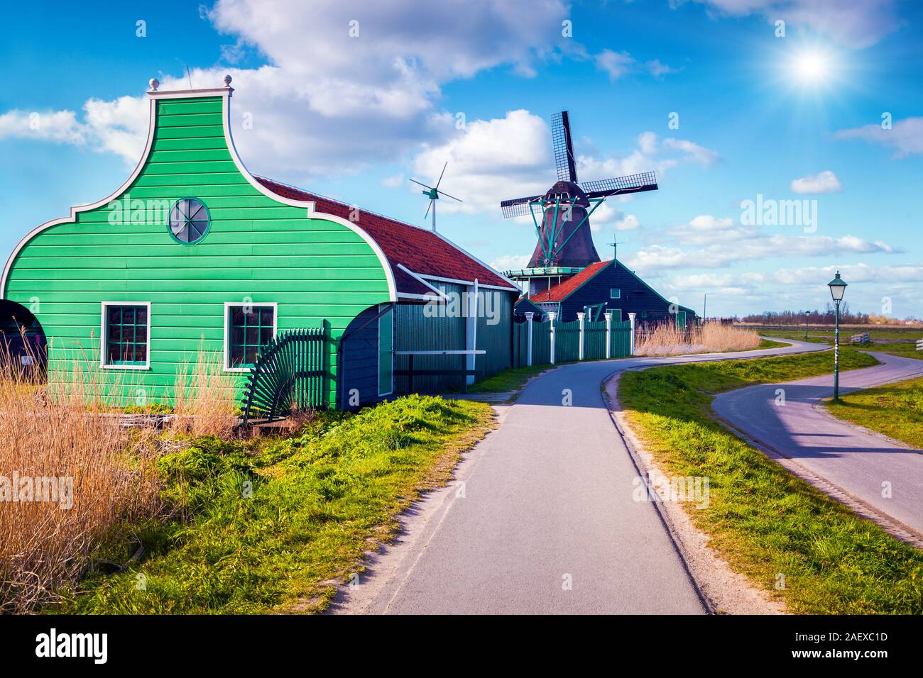 Authentic Zaandam mills on the water channel in Zaanstad village. Zaanse Schans Windmills and famous Netherlands canals, Europe Stock Photo