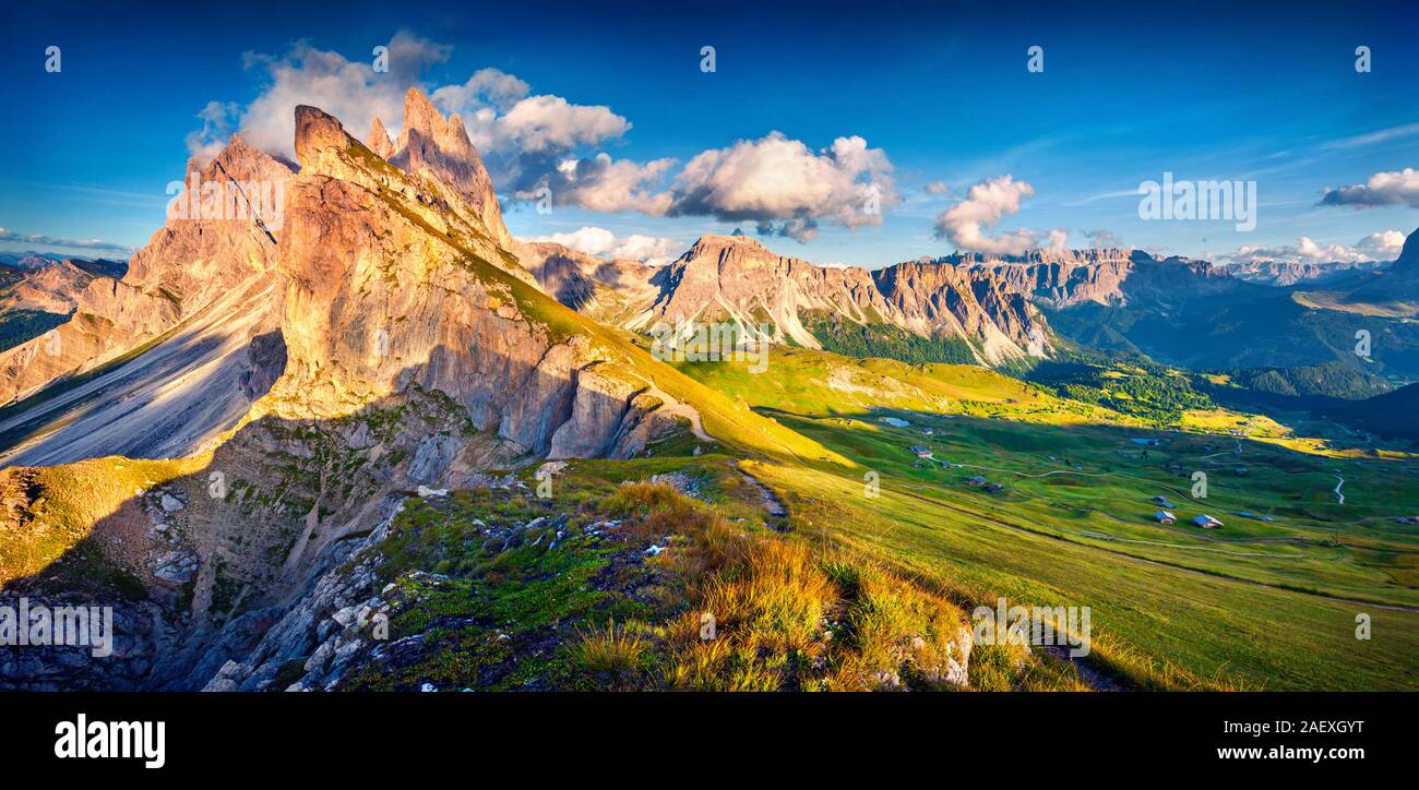 Evening panorama of Gardena valley. Colorful view of Sass Rigais and Furchetta mountains in Puez Odle National Park. Colorful landscape in Dolomite Al Stock Photo