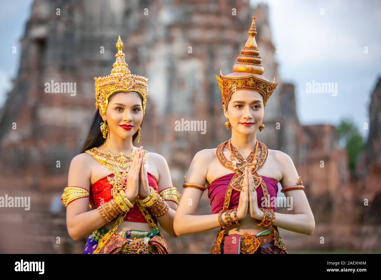 Asia woman wearing traditional Thai dress,The costume of the national dress  of ancient Thailand against temple Stock Photo - Alamy