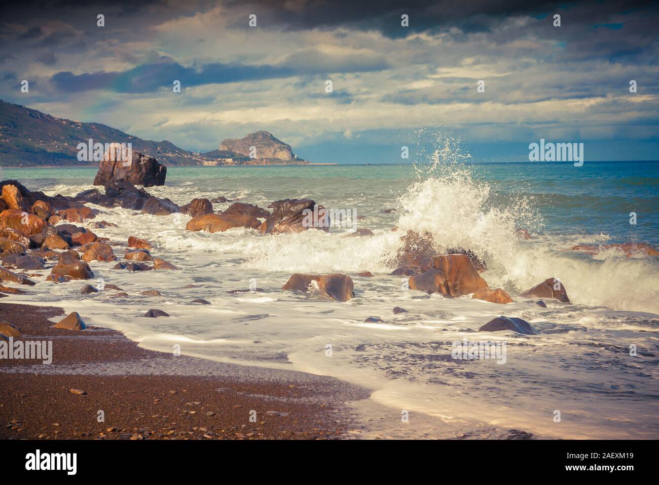 Stormy spring morning on the beach Torre Conca (cape Rais Gerbi) at the Tyrrhenian sea. View of the Celalu cape, Sicily, Italy, Europe. Stock Photo