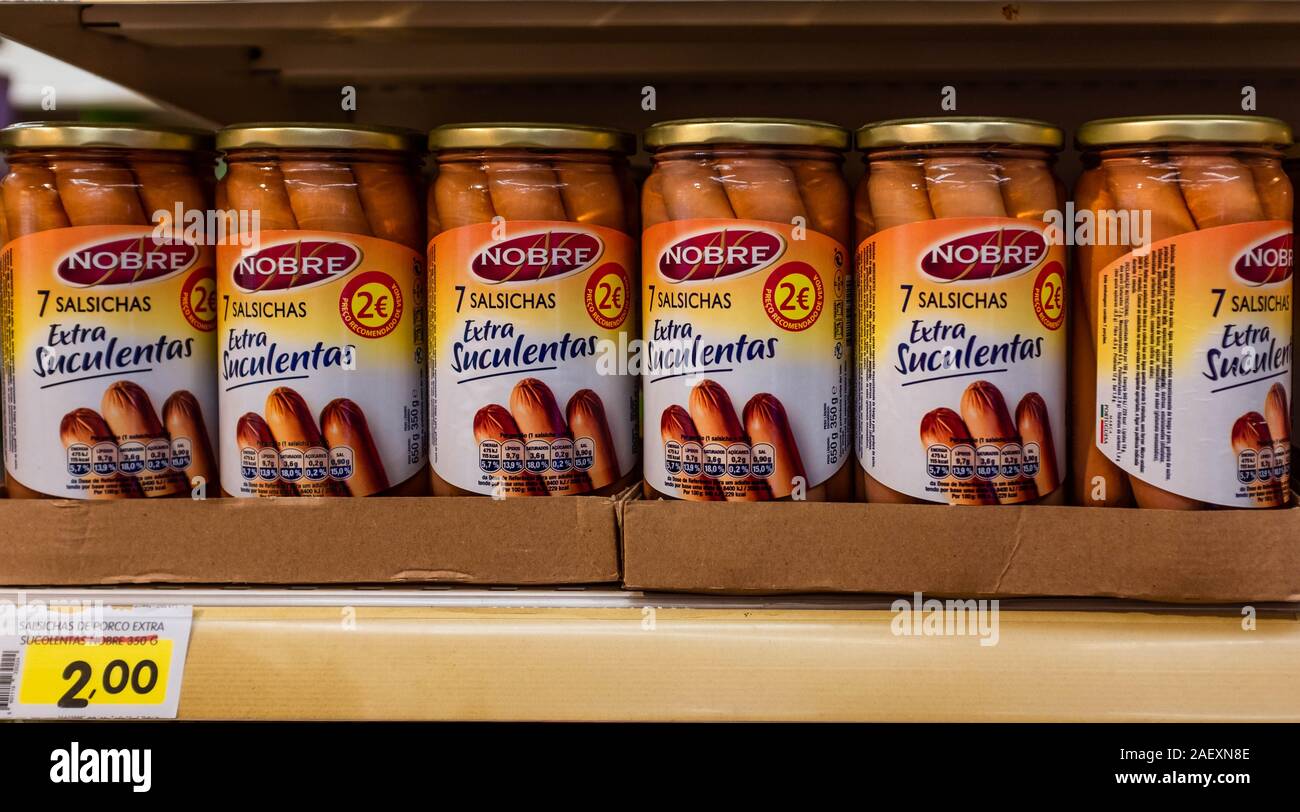 Canned turkey meat sausages produced by Portuguese meat production company Nobre on a shelf in grocery store. Stock Photo