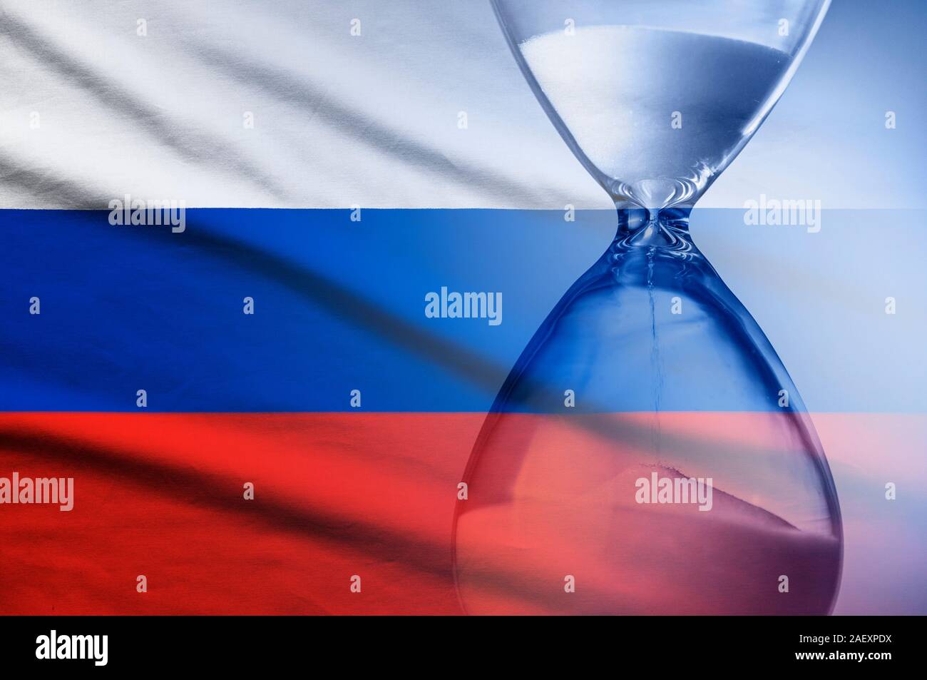 Hourglass superimposed over a Russian flag, deadline Stock Photo