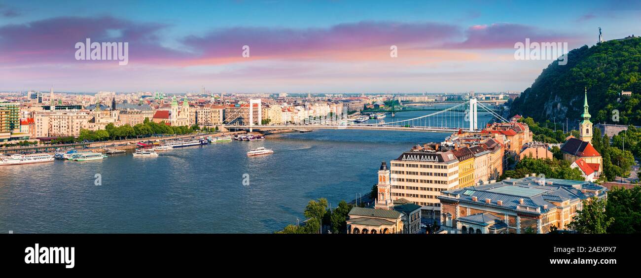 Panoramic cityscape of Pest city with Elisabeth Bridge on the Danube river. Colorful spring sunset in Budapest, Hungary, Europe. Artistic style post p Stock Photo