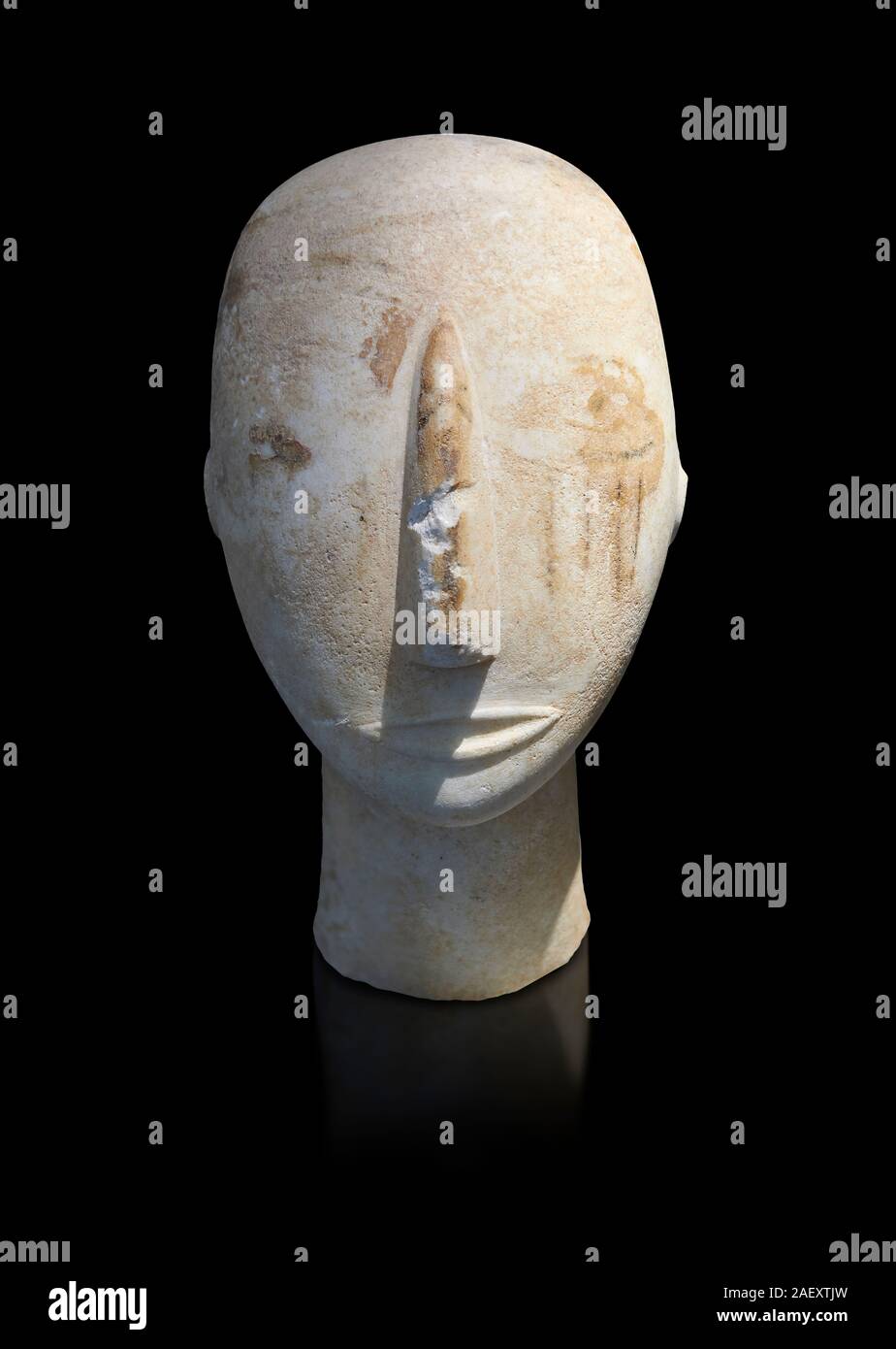 Head of a Cycladic statue with remnants of painted eyes and right cheek