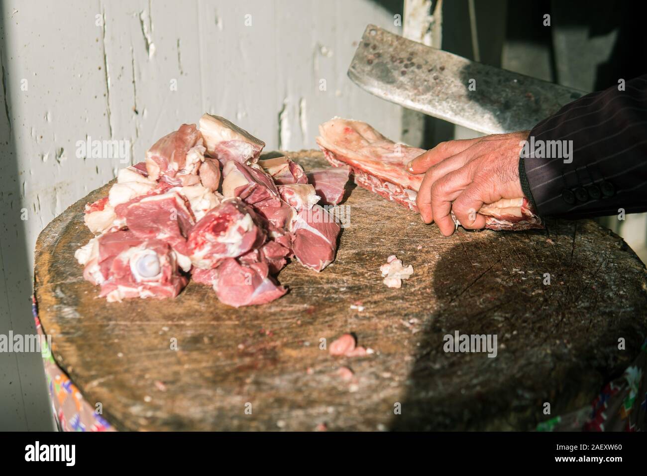Meat or butcher shop at vintage or old market. Fresh meat on wooden stump. Stock Photo