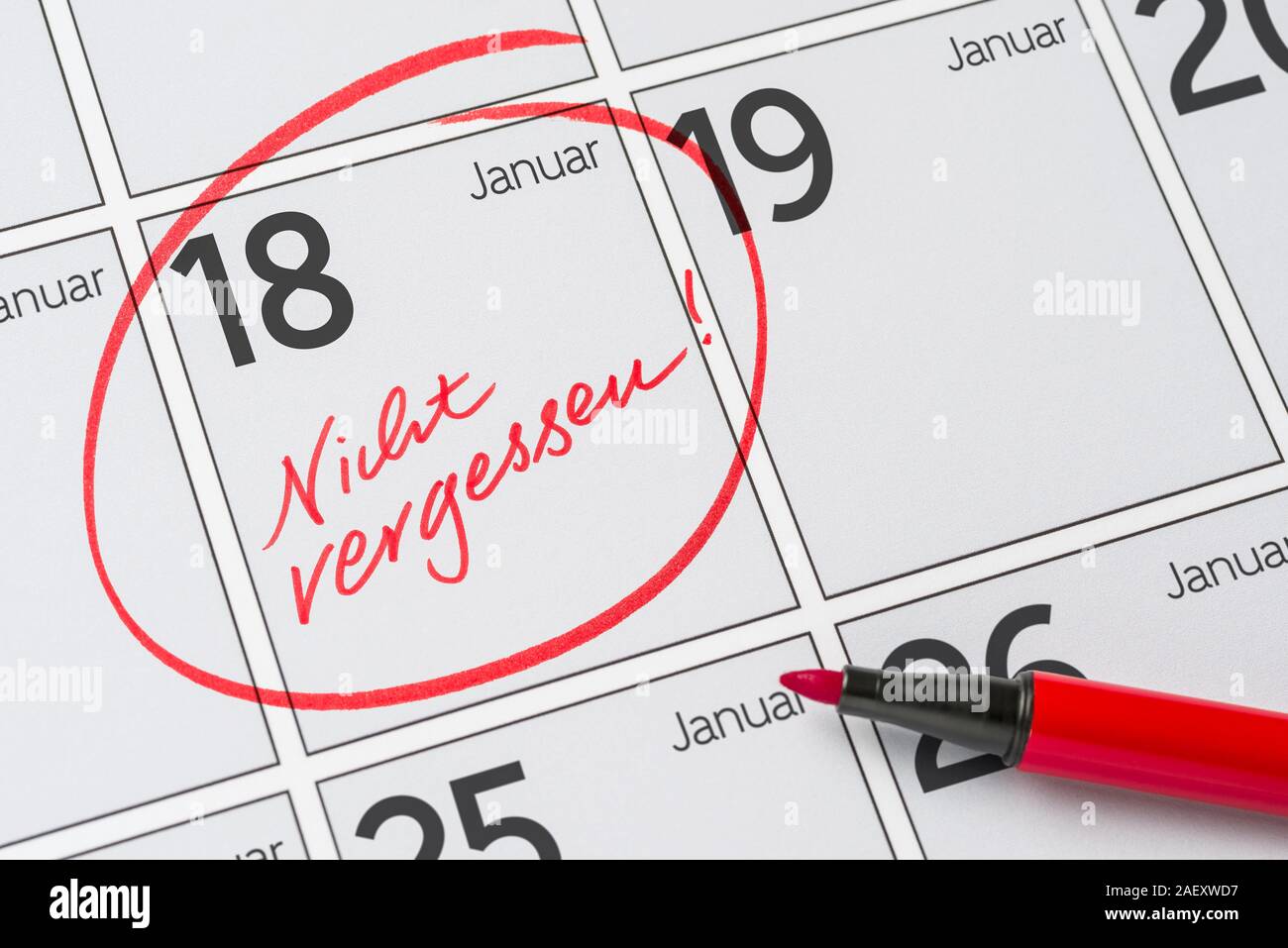 Save the Date written on a calendar - January 18 - Nicht vergessen in