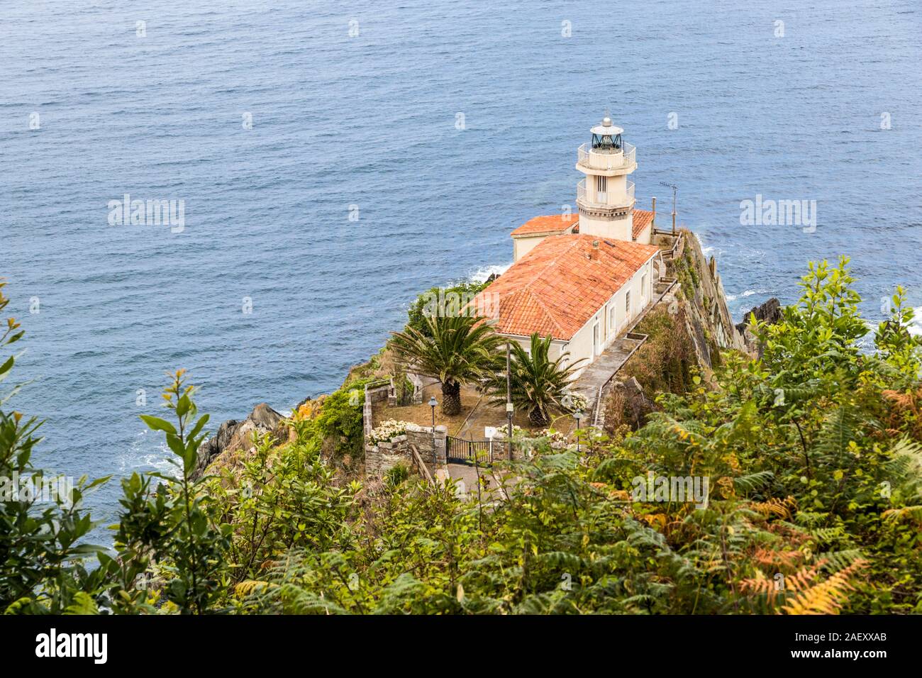 Cudillero, Spain. Aerial and colorful view of the lighthouse in a warm and beautiful summer day Stock Photo