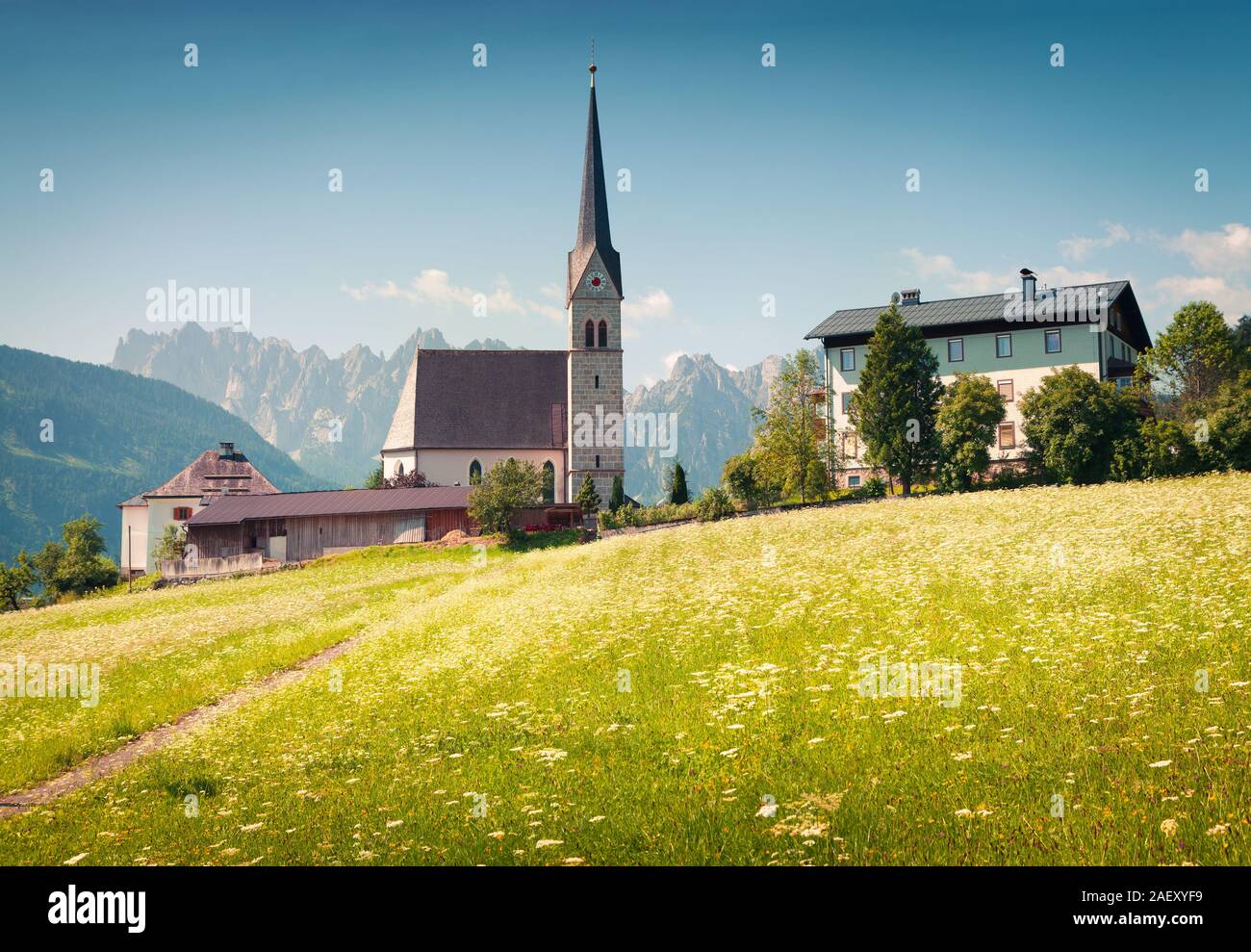 Bright sunny morning in Gosau village with Christianity churh. Colorful outdoor scene in Austrian Alps, Liezen District of Styria, Austria. Europe. Ar Stock Photo