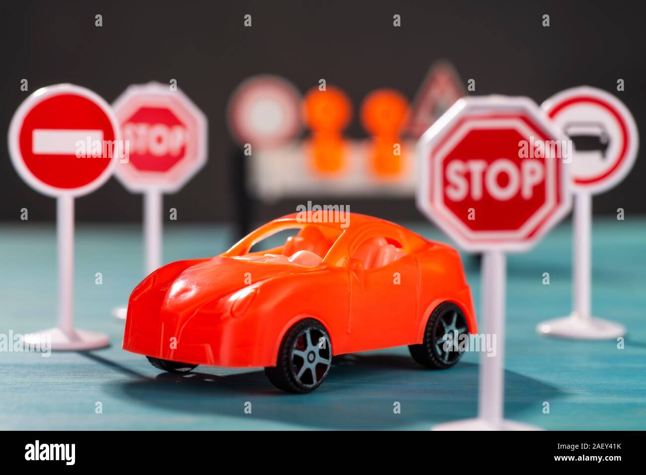 A car stands between traffic signs with prohibitions Stock Photo