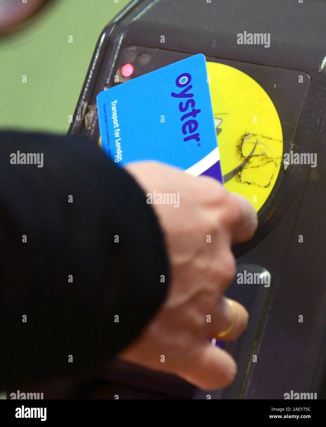 An Oyster card is used at a tube station in London Stock Photo Alamy