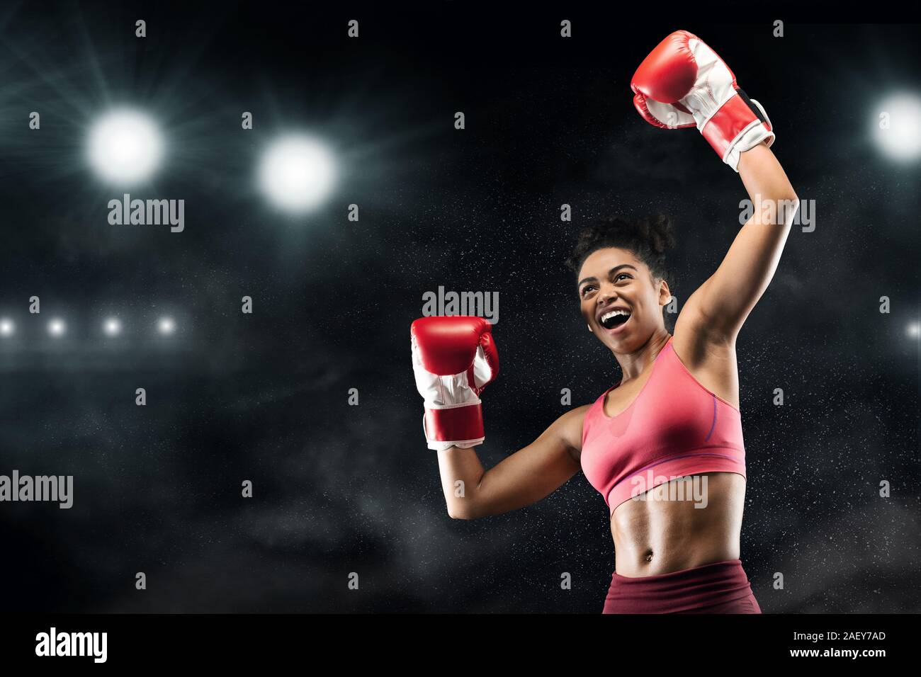 Winner female boxer arms raised hires stock photography and images Alamy