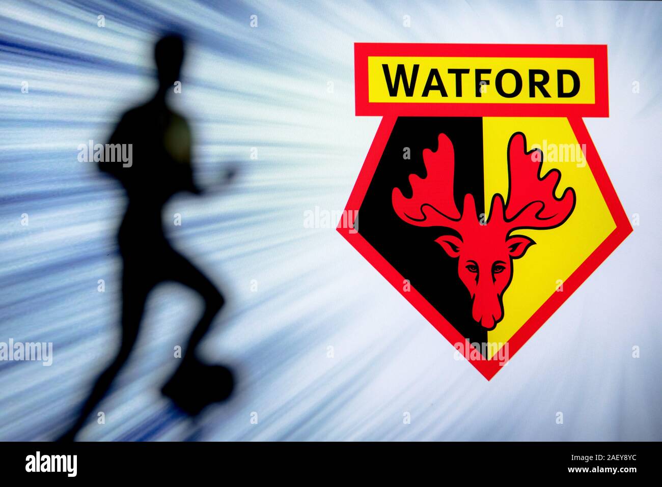 WATFORD, ENGLAND, JULY. 1. 2019: Watford Football club logo, Premier League, England. Soccer player silhouette. Stock Photo