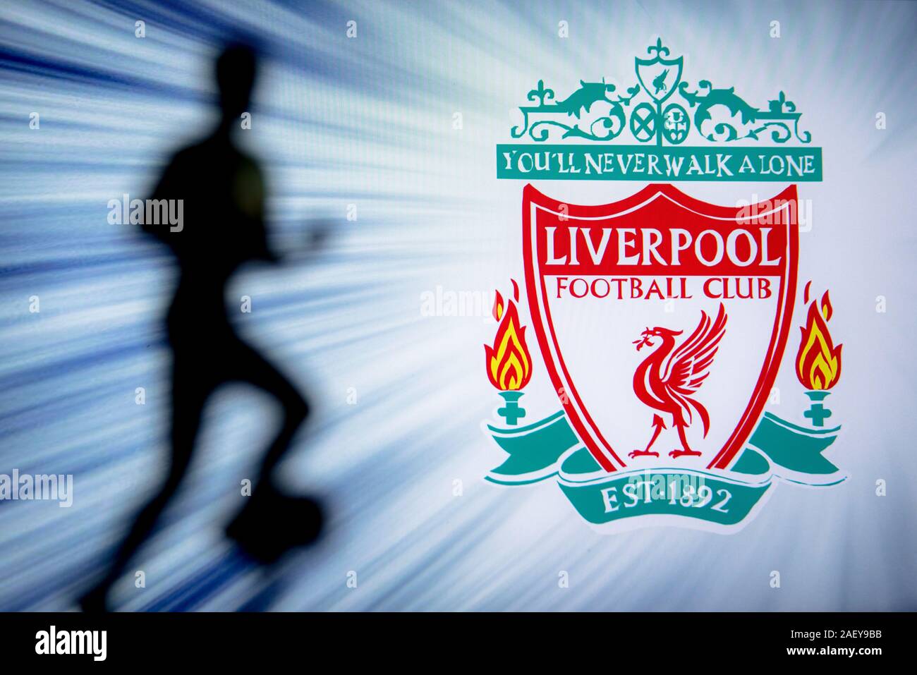 LIVERPOOL, ENGLAND, JULY. 1. 2019: Liverpool Football club logo, Premier League, England. Soccer player silhouette. Stock Photo