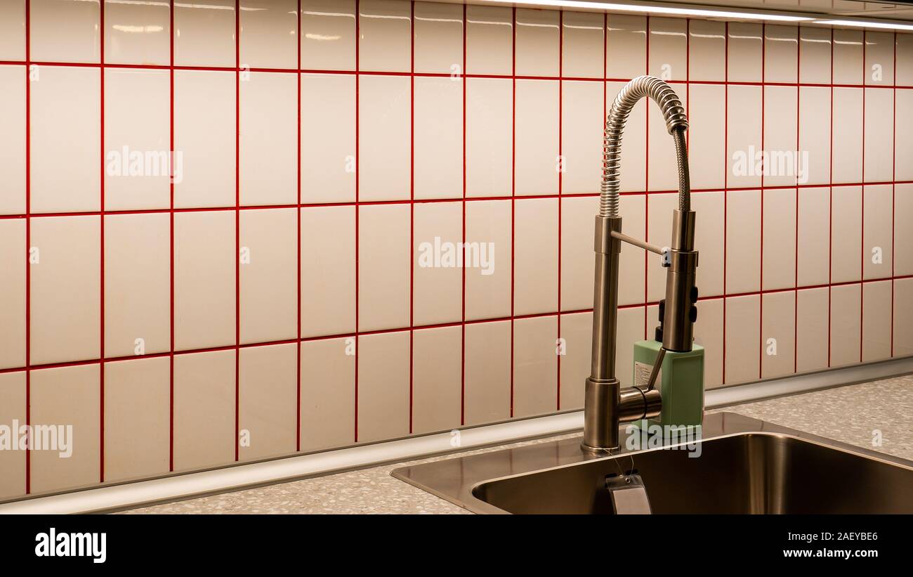 Kitchen made of fine tiles with red lines Stock Photo Alamy