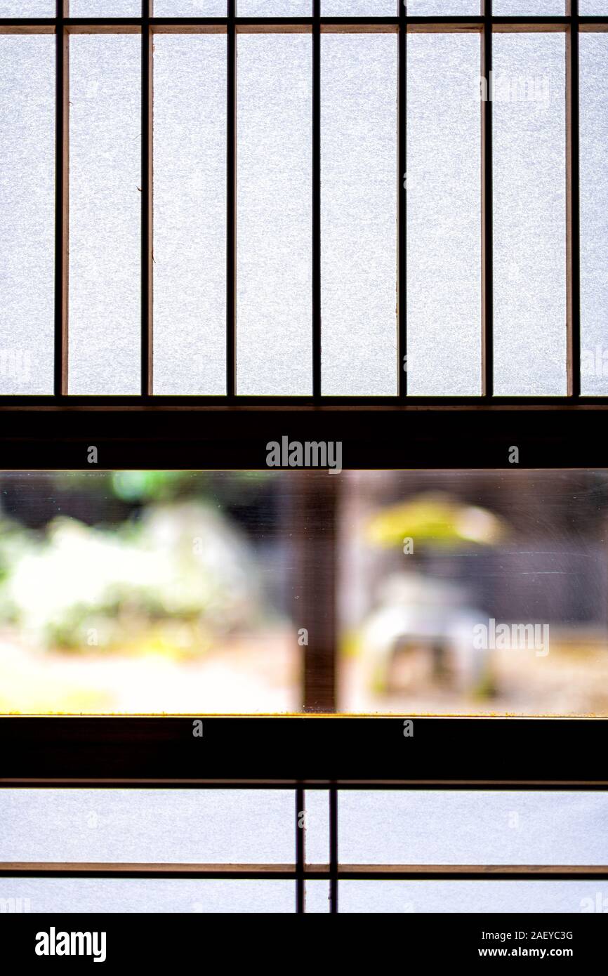 Abstract view of traditional japanese house onsen ryokan hotel in Japan with shoji sliding paper doors and window to green garden Stock Photo