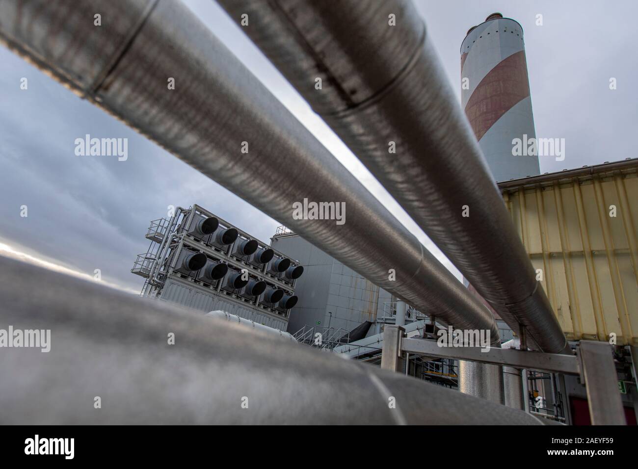 The Swiss company Climeworks are running 30 DAC - Direct Air Capture - fans on the roof of this garbage incinerator in Hinwil outside Zurich. Founded in 2009 by Christoph Gebald and Jan Wurzbacher, the company has commercialized the modular carbon capture unit, each of which is capable of sucking up to 135 kilo of CO2 out of the air daily. The process is energy demanding, and the units in Hilwil utilize excess energy from the incinerator to run the collectors. In turn, the captured CO2 is used at a nearby commercial greenhouse to increase the crop yield and also delivered to a mineral water ma Stock Photo