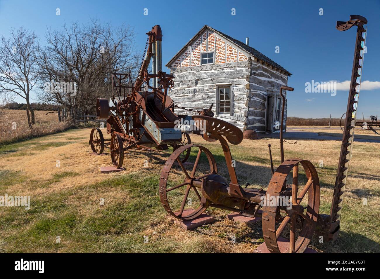 Beatrice, Nebraska - The Palmer-Epard Cabin at Homestead National Monument, with antique farm machinery. Stock Photo
