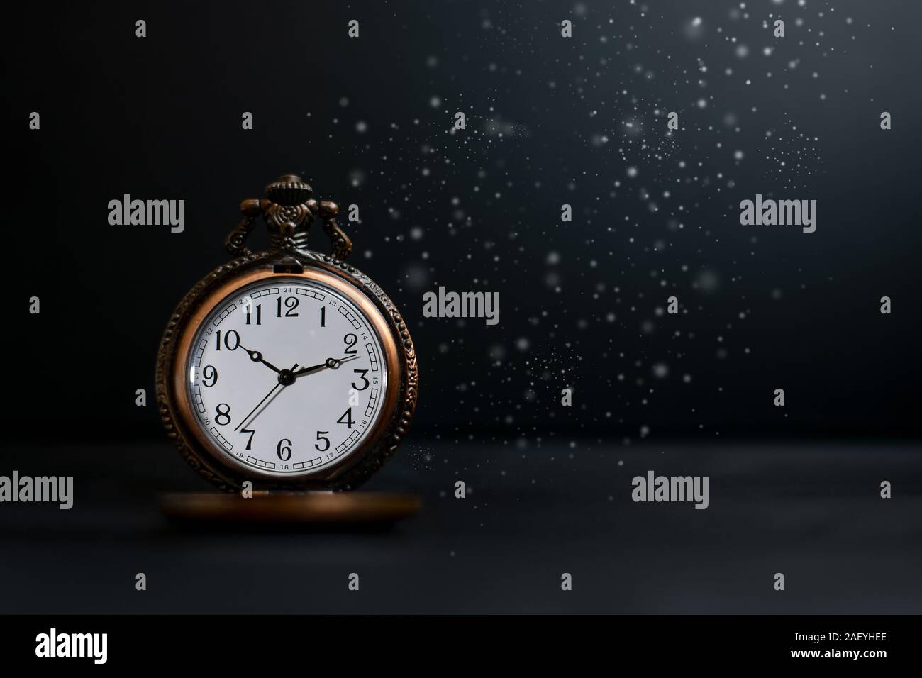 Old pocket watch on dark background Stock Photo