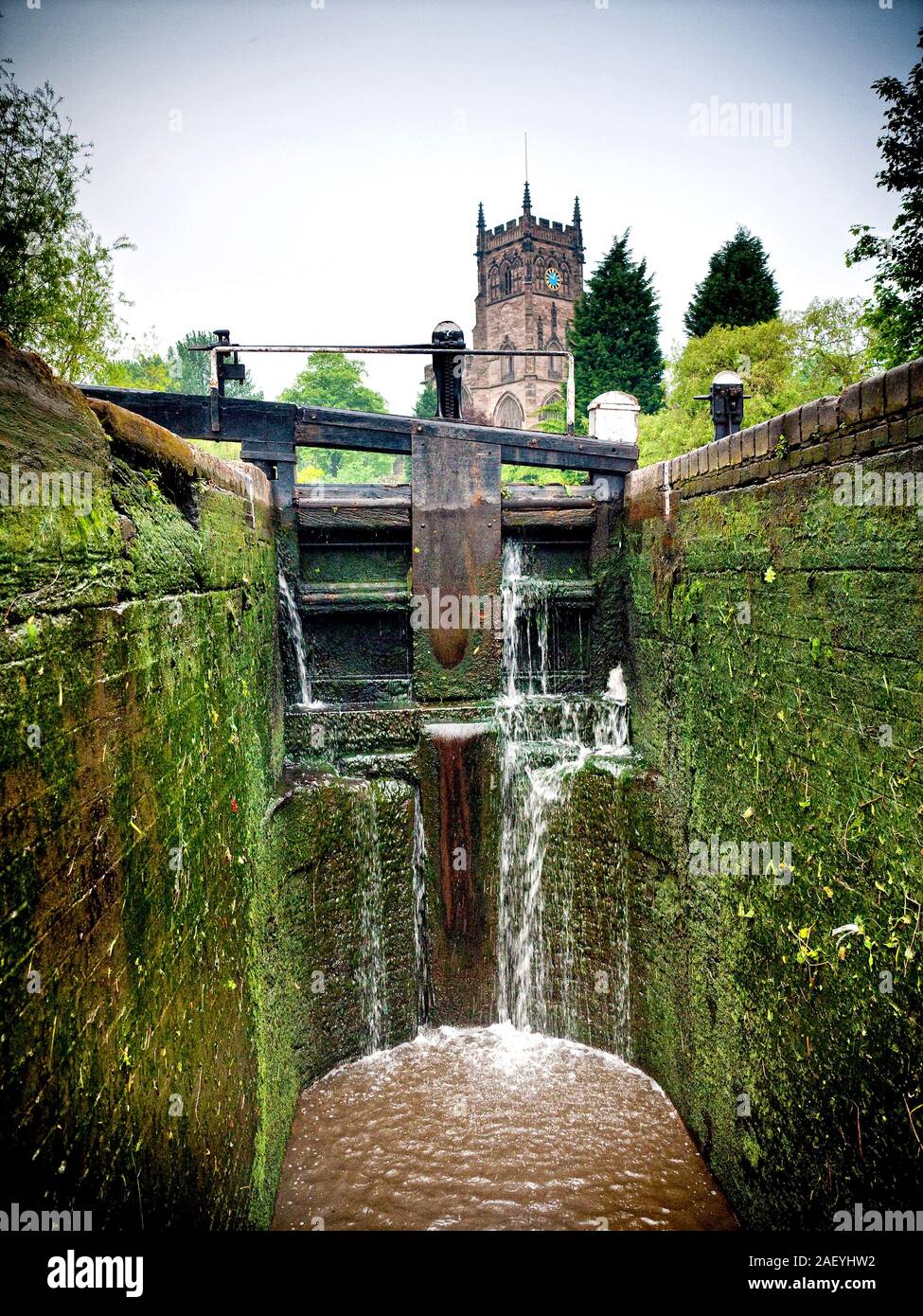 Interior of a narrow Lock with St Mary's Church at Kidderminster, UK Stock Photo