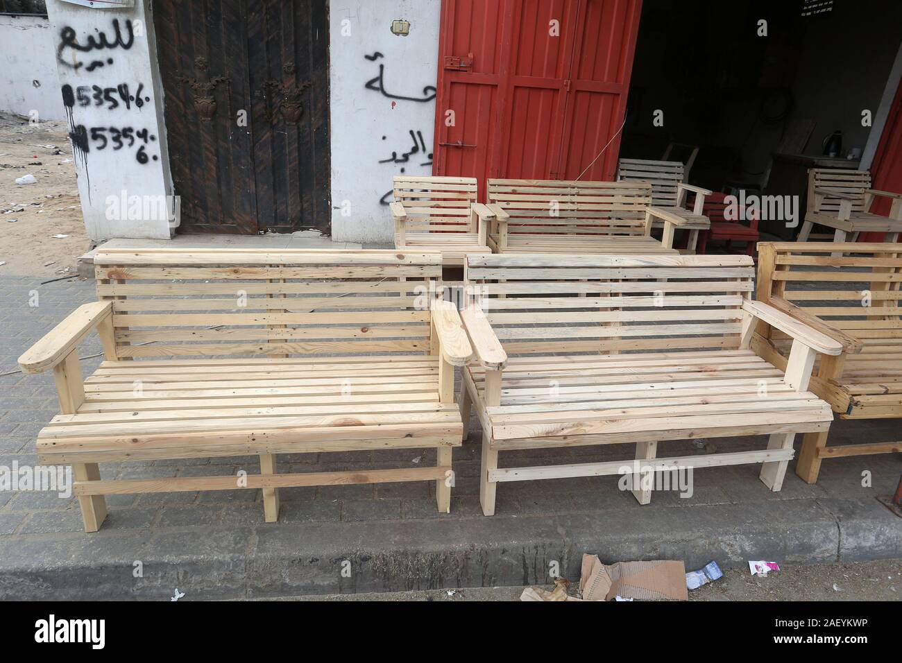 Palestinian man makes chairs from used wood, due to their inability to purchase new wood because of the deteriorating economic, in Gaza Strip. Stock Photo