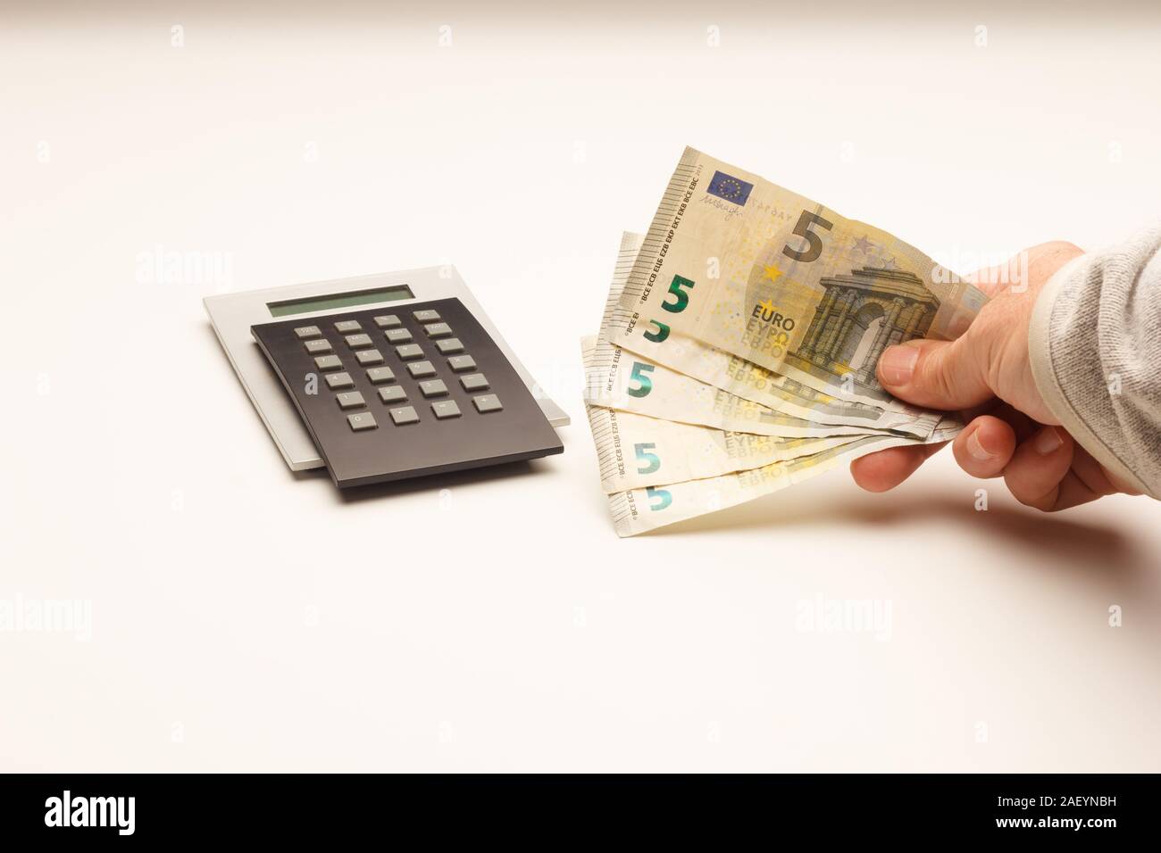 Financial and mathematical calculations helped by a calculator to pay the  bank or to make daily purchases in times of crisis. Buy and pay for  commodit Stock Photo - Alamy