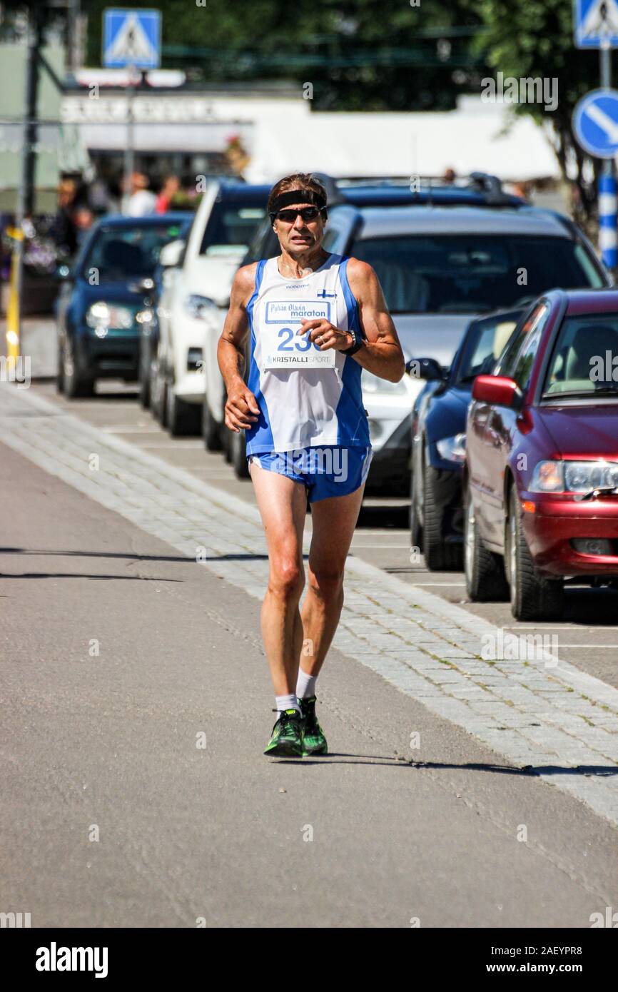 Competitor of Pyhän Olavin Marathon running in Savonlinna, Finland Stock Photo