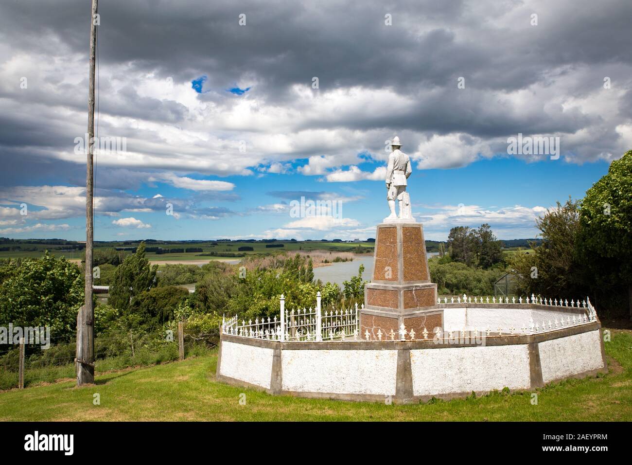 Otago, South Island, New Zealand, December 8 2019:  A war memorial to remember fallen soldiers stands proud on a hilltop overlooking the Clutha River, Stock Photo