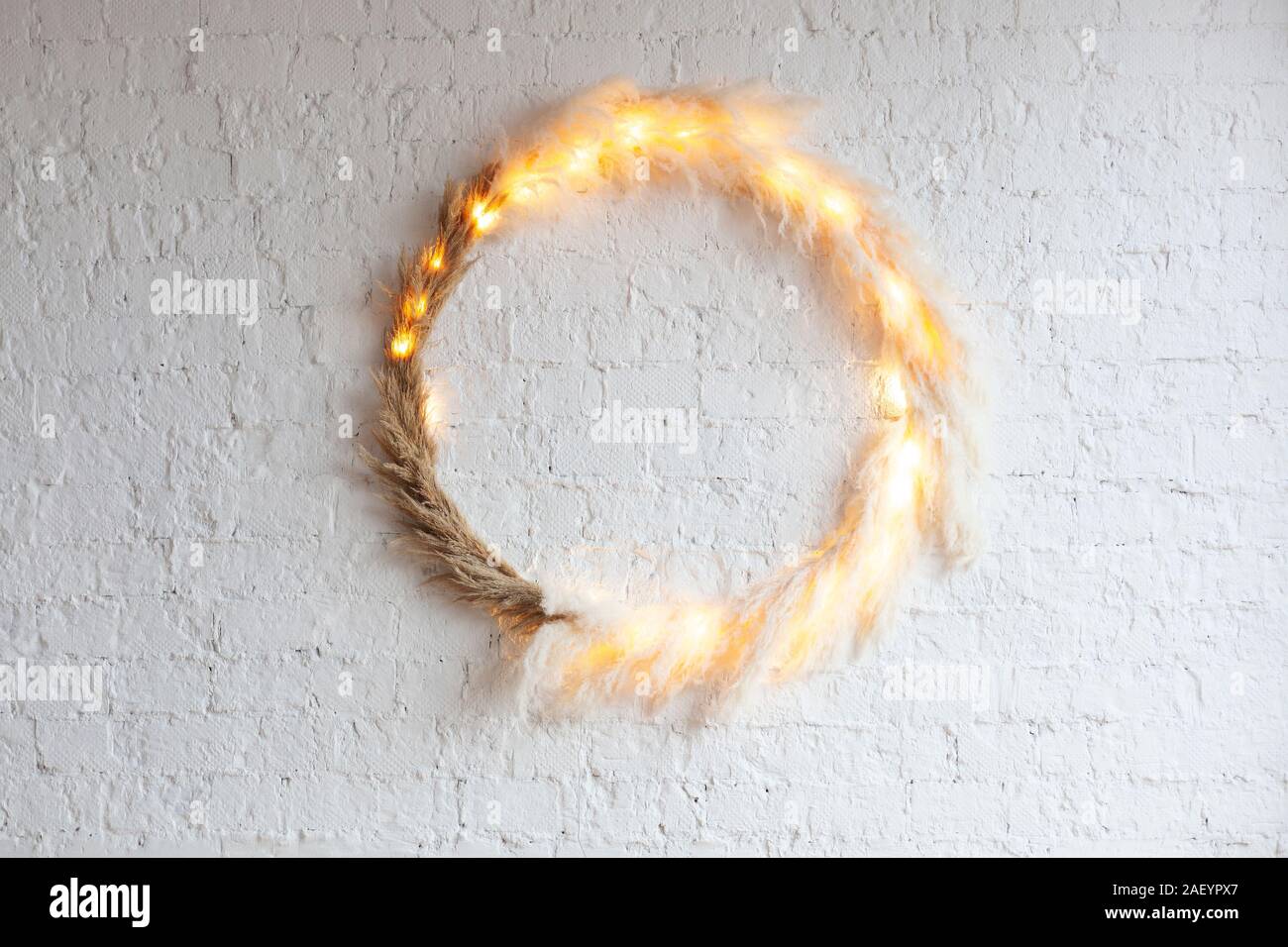 Incredible Scandinavian style decorative ring on a white wall with backlight. Stock Photo